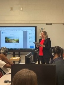 employee speaking to students