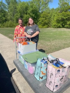 Bank Employee giving donations to Nursing Home Employee