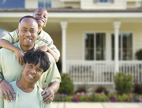 Family in front of home.