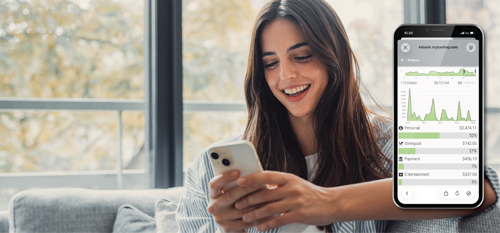 Smiling Woman at home looking at phone with close-up of phone banking app overlayed